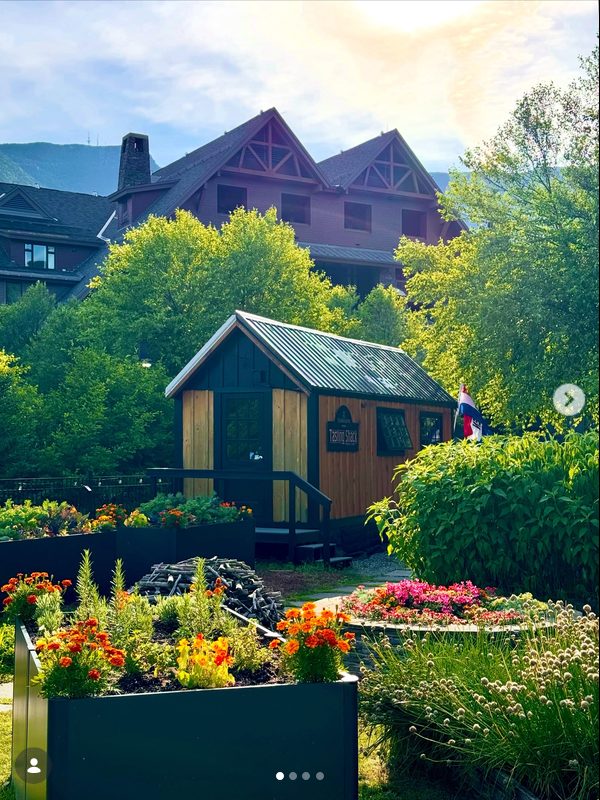 Tasting Shack in summer surrounded by flower gardens