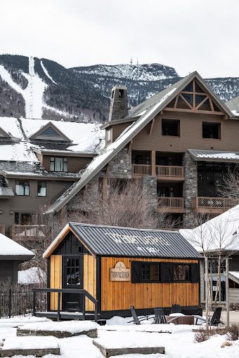 Tasting Shack in winter snow below the resort